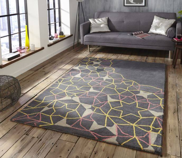 What are the benefits of using handmade rugs in interior design?